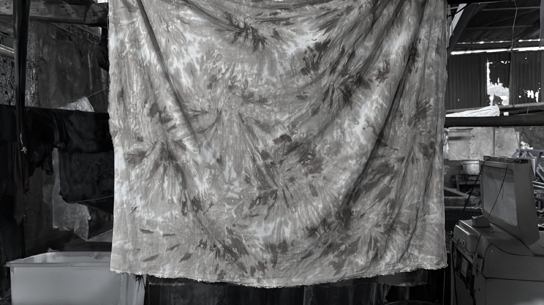 Hand-dyed fabric hanging to dry in the Nousa Concept workshop in Bali