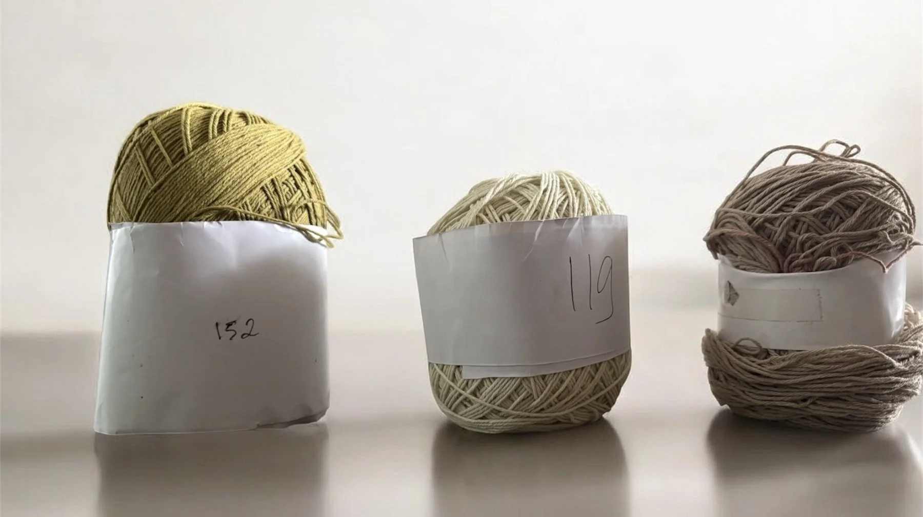 Hand-numbered yarn colour references for a Nousa Concept small-batch run