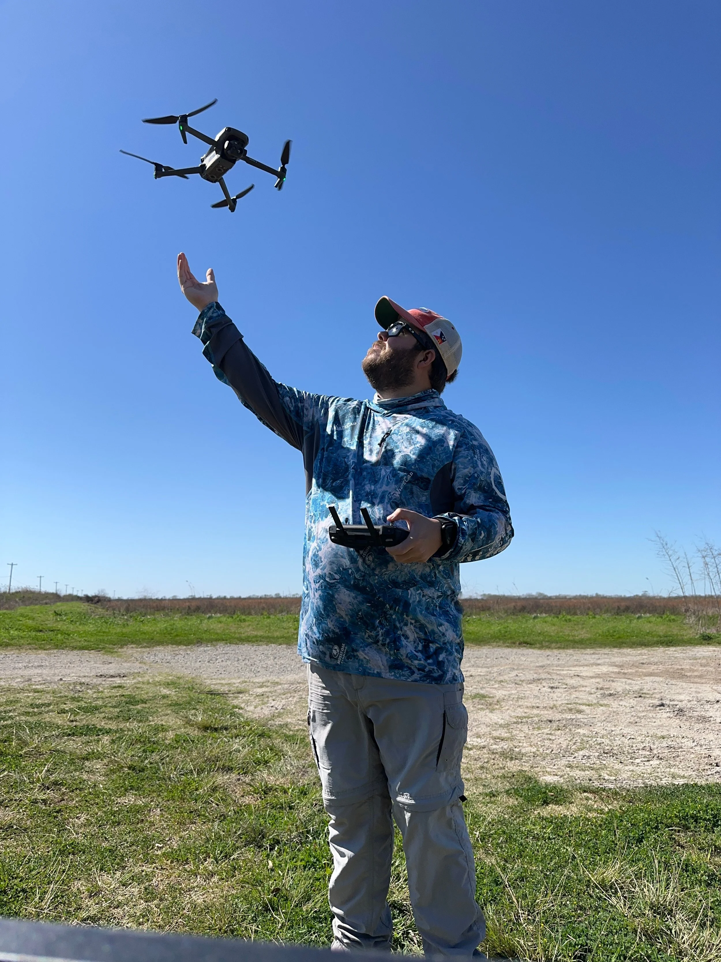 Charles Schlicher Jr launching a drone