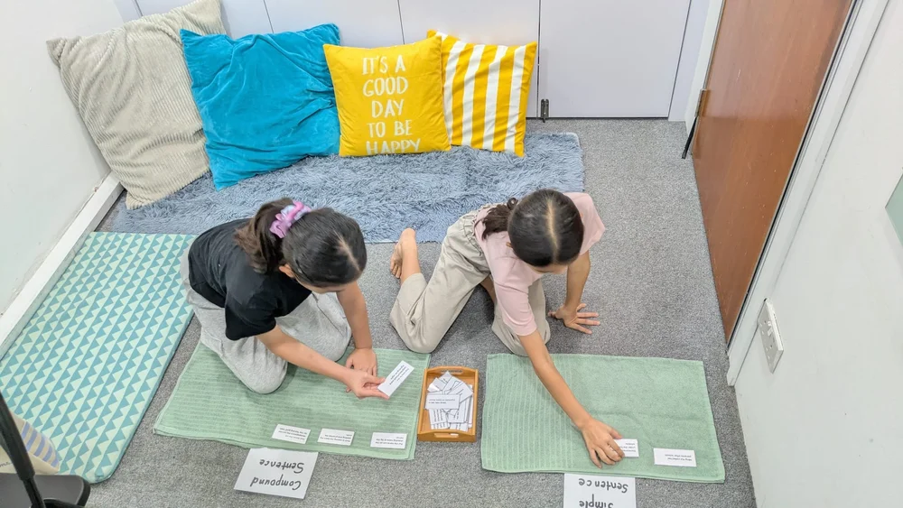 Primary 3 and 4 students learning maths with a hands-on activity at KnowledgeTrail, Upper Thomson