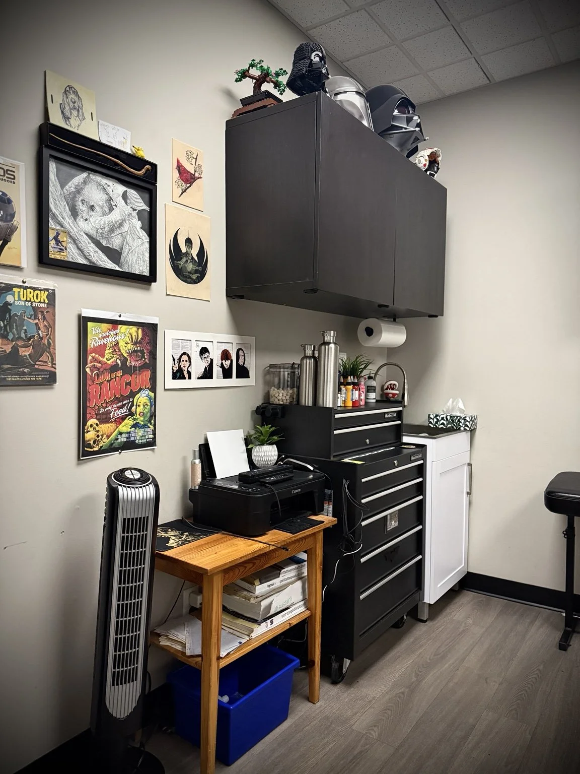 Chris Kennedy’s tattoo workstation and art wall at Lakeside Tattoos