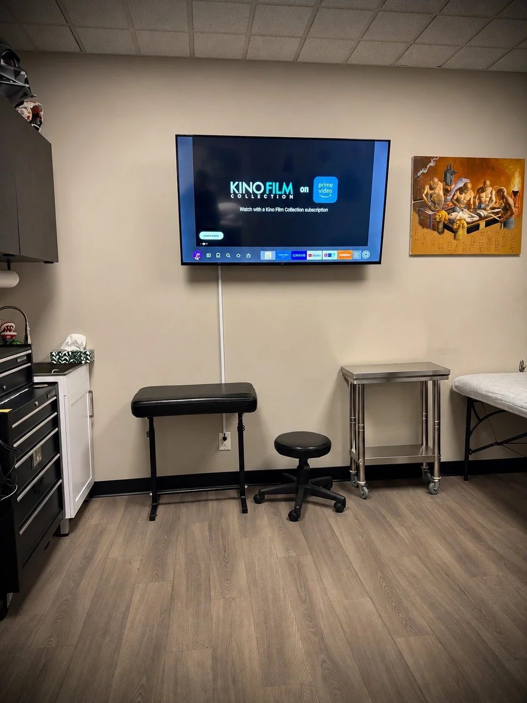 Television, armrest and seating inside Lakeside Tattoos