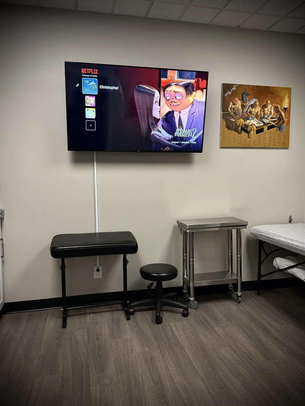 Television, armrest and seating inside Lakeside Tattoos