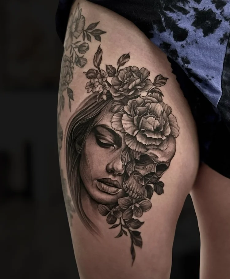 Chris Kennedy’s black and grey woman, skull and flowers tattoo