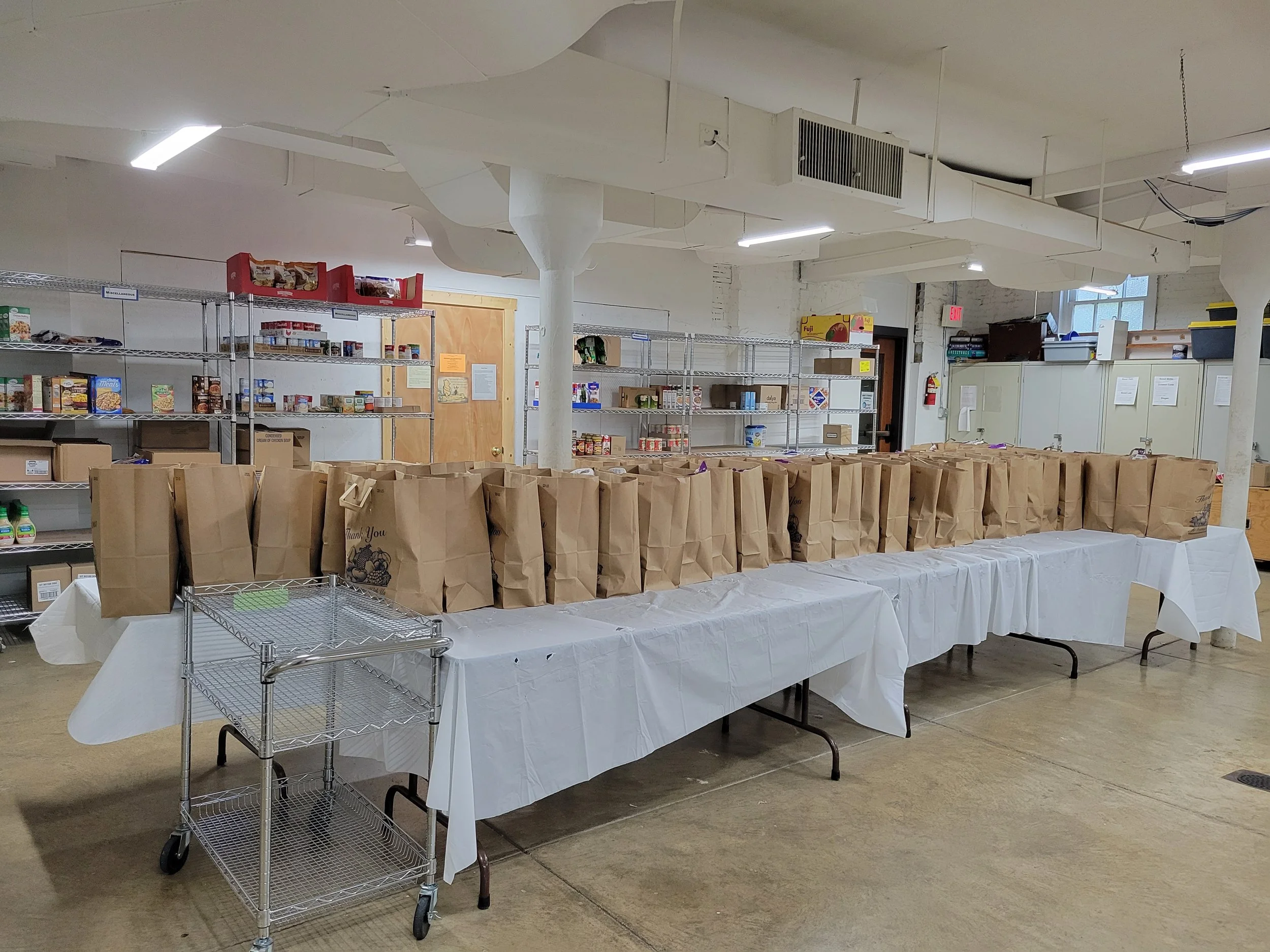 Volunteers preparing food pantry items
