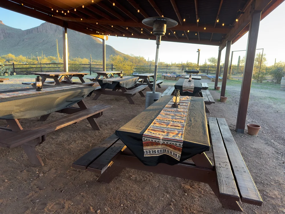 Table set for a desert dinner under the stars