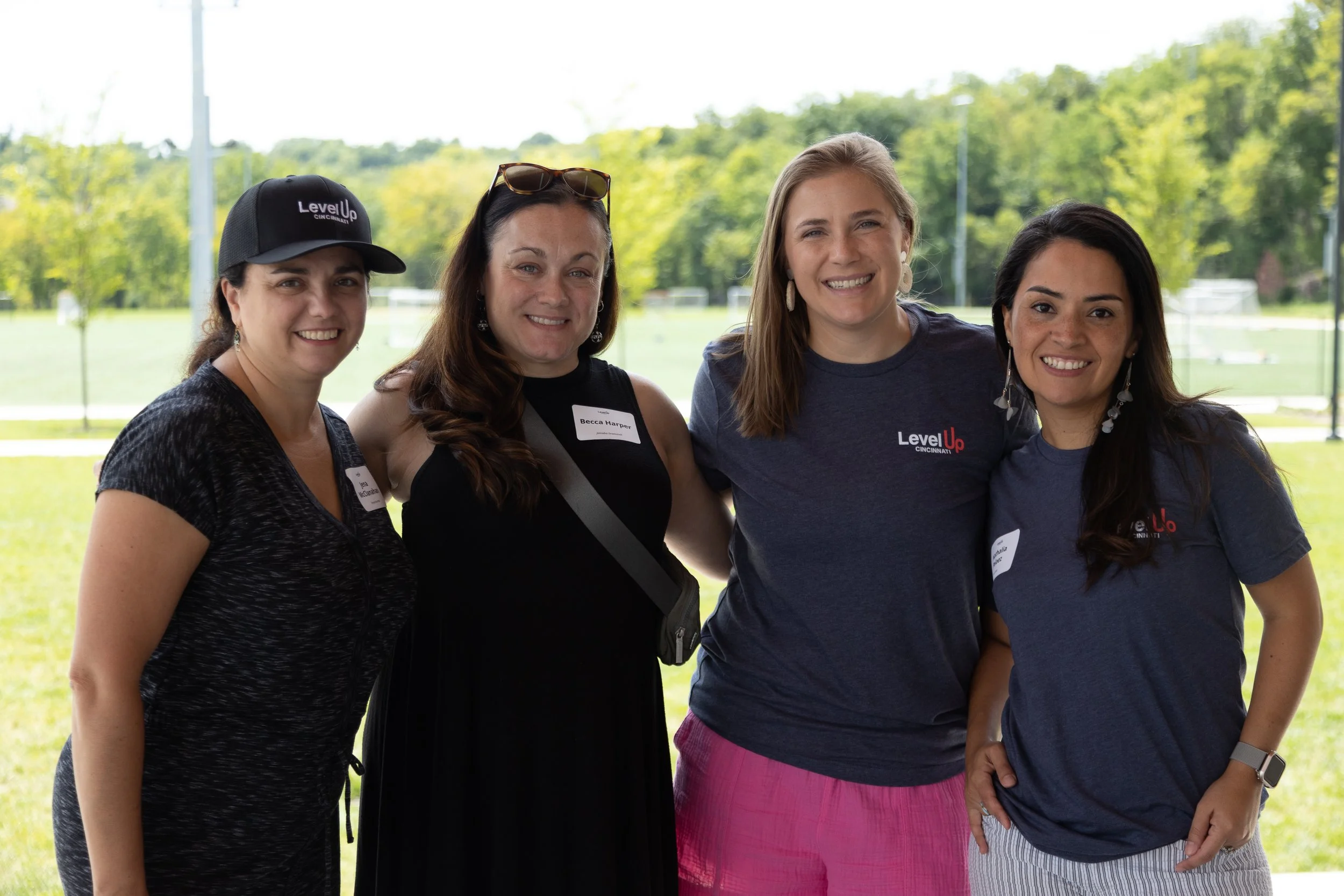 Level Up Cincinnati coaches mentoring students in a collaborative setting