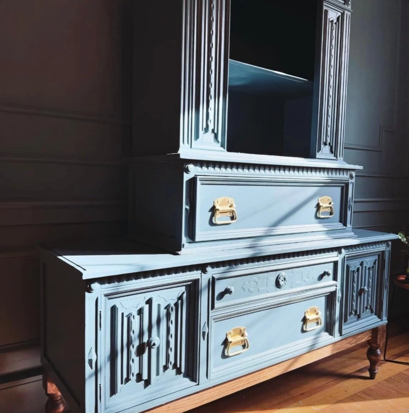 Ornate vintage cabinet reconditioned in blue with brass hardware