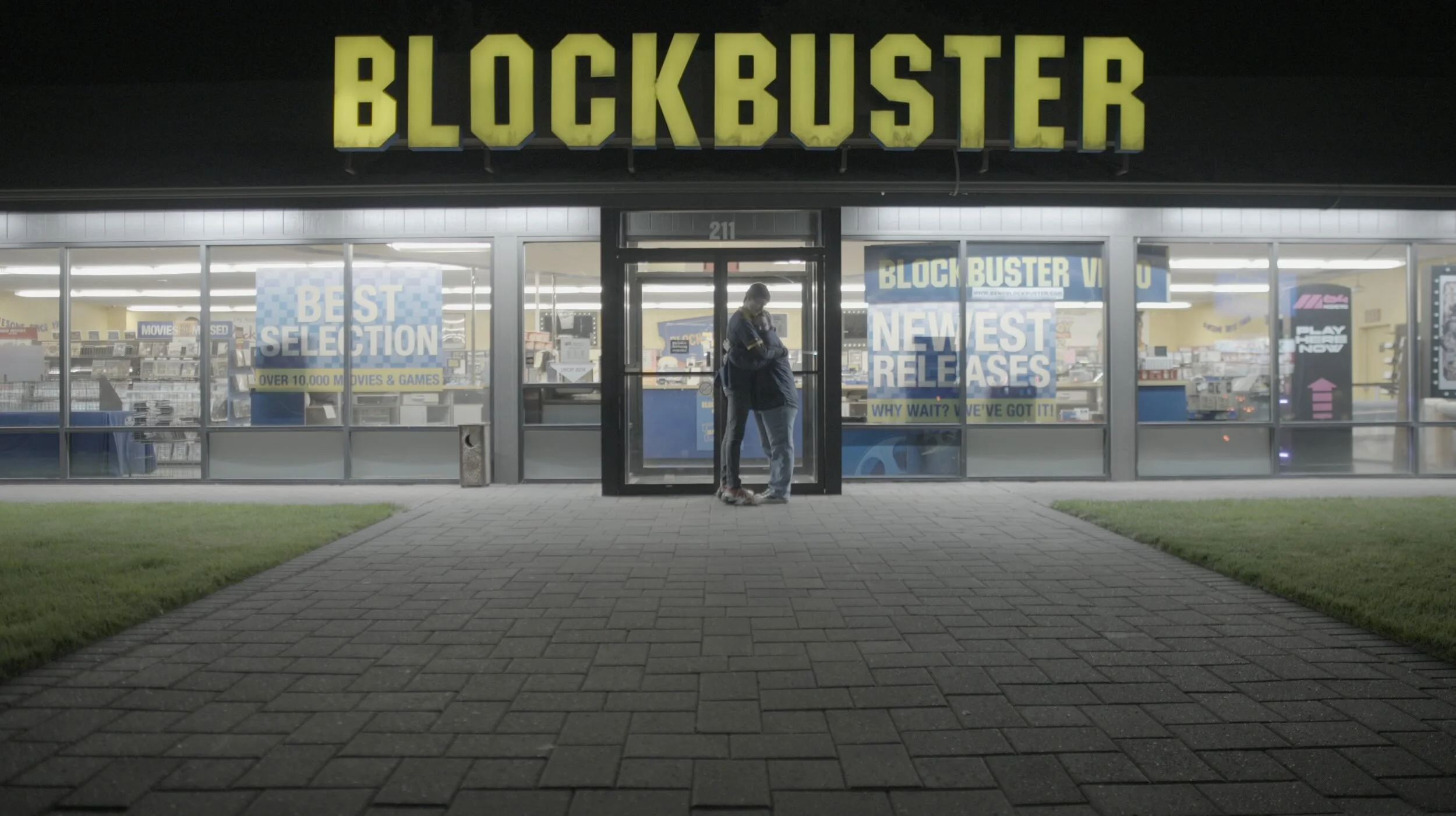The Last Blockbuster storefront at night, from Rewind