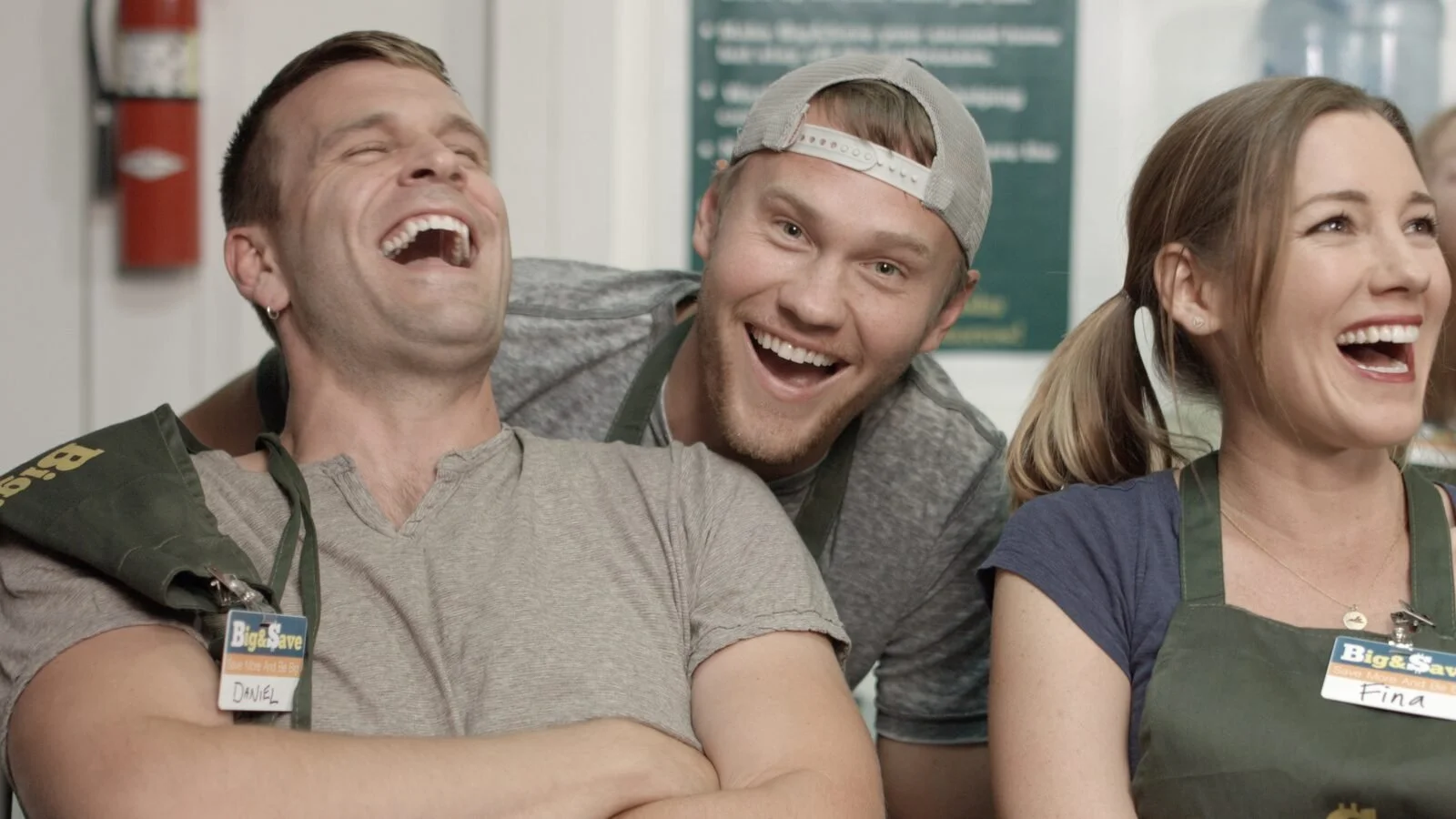 The cast of Big & $ave laughing in the store
