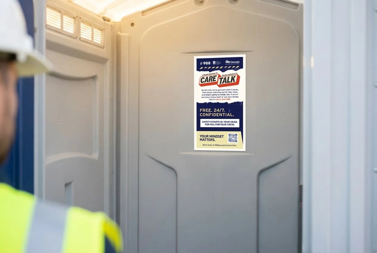 988 English-language decal mounted inside a jobsite porta-potty door