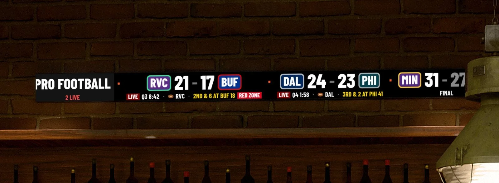 Concept rendering of an LED sports ticker for bars showing live pro football scores with team abbreviations in colored badges, RVC 21 BUF 17 and DAL 24 PHI 23, mounted above a back bar