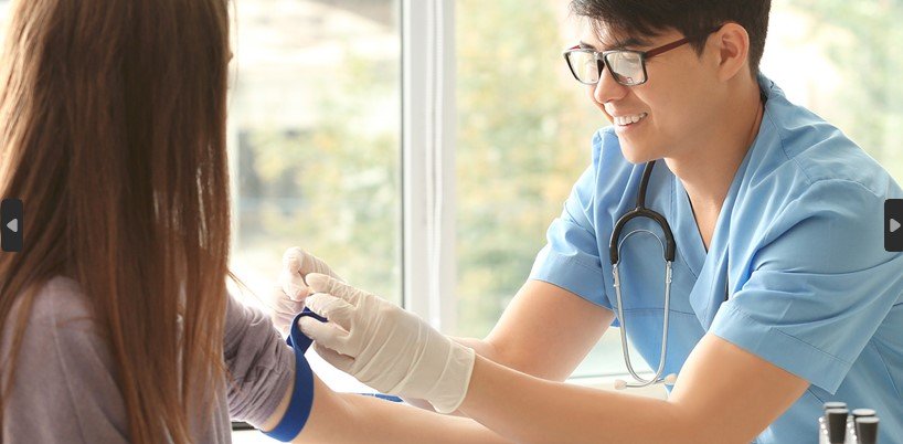 a-male-phlebotomist-ties-a-tourniquet-on-a-female-patient