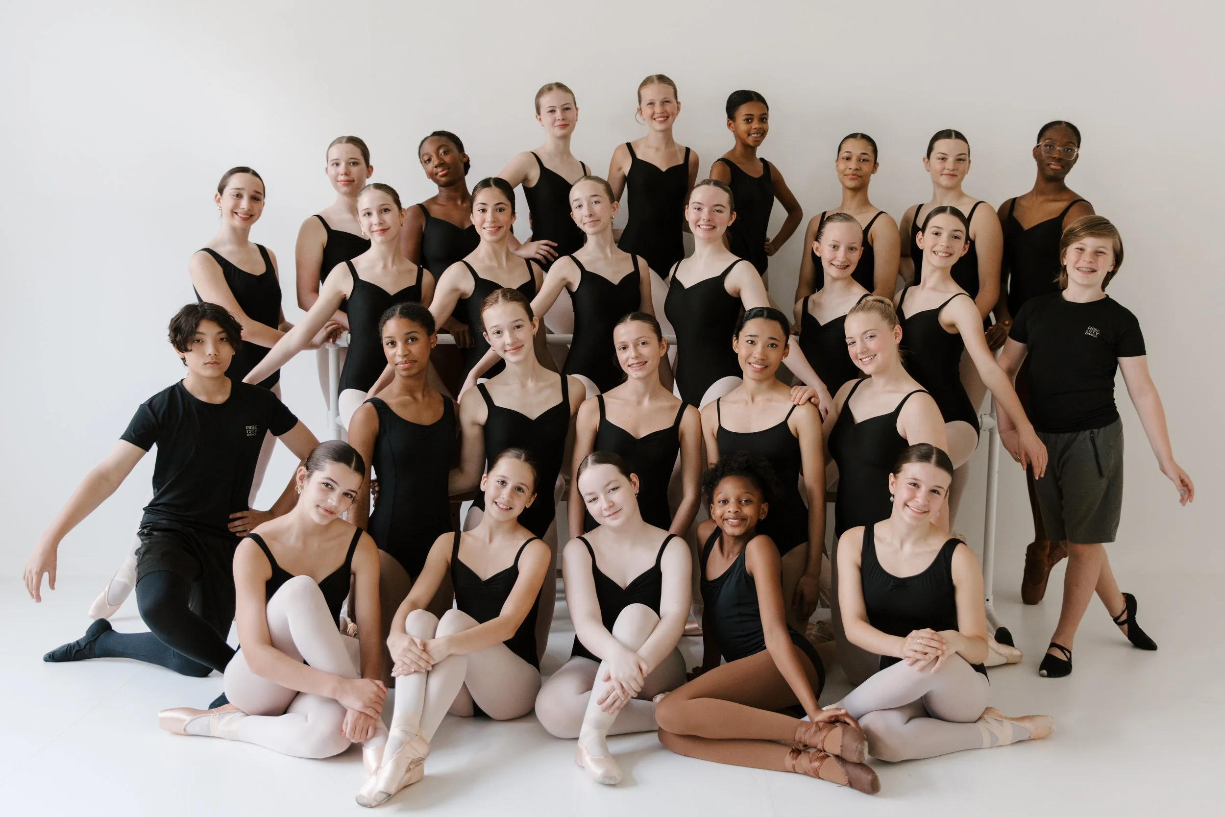 The full Rise City Dance company posed together in the studio