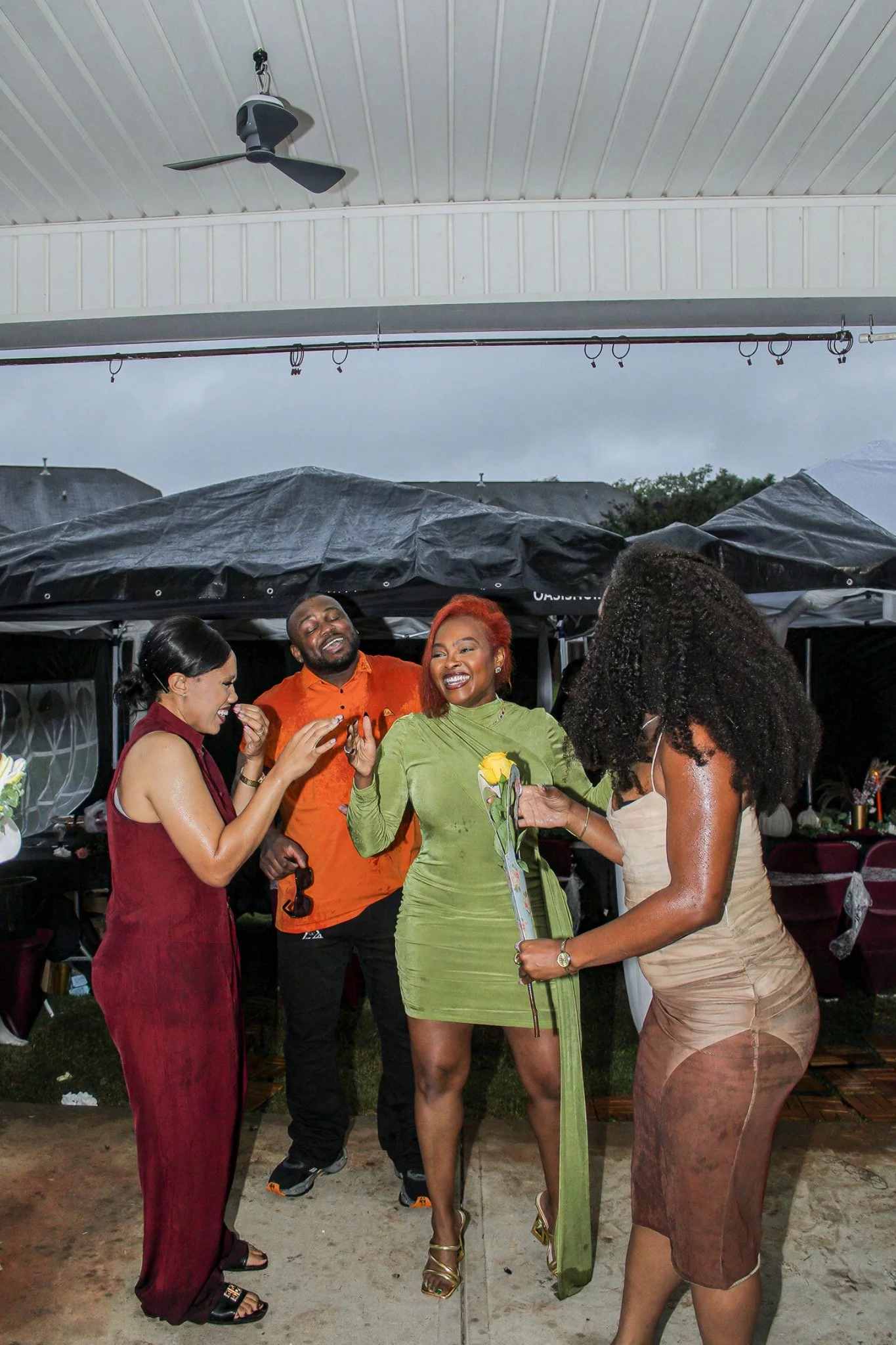 Friends sharing a happy moment under the canopy
