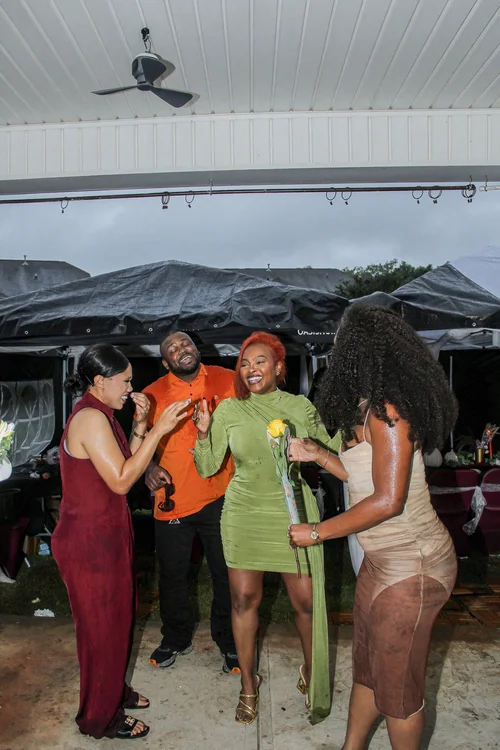 Friends sharing a happy moment under the canopy