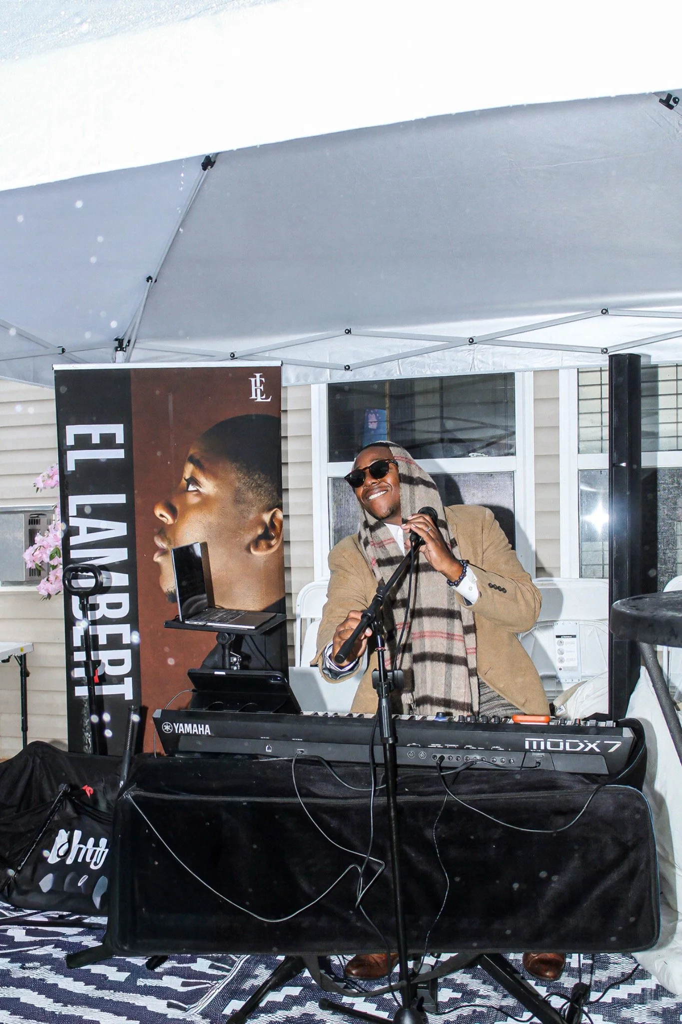 Live musician performing under the party tent