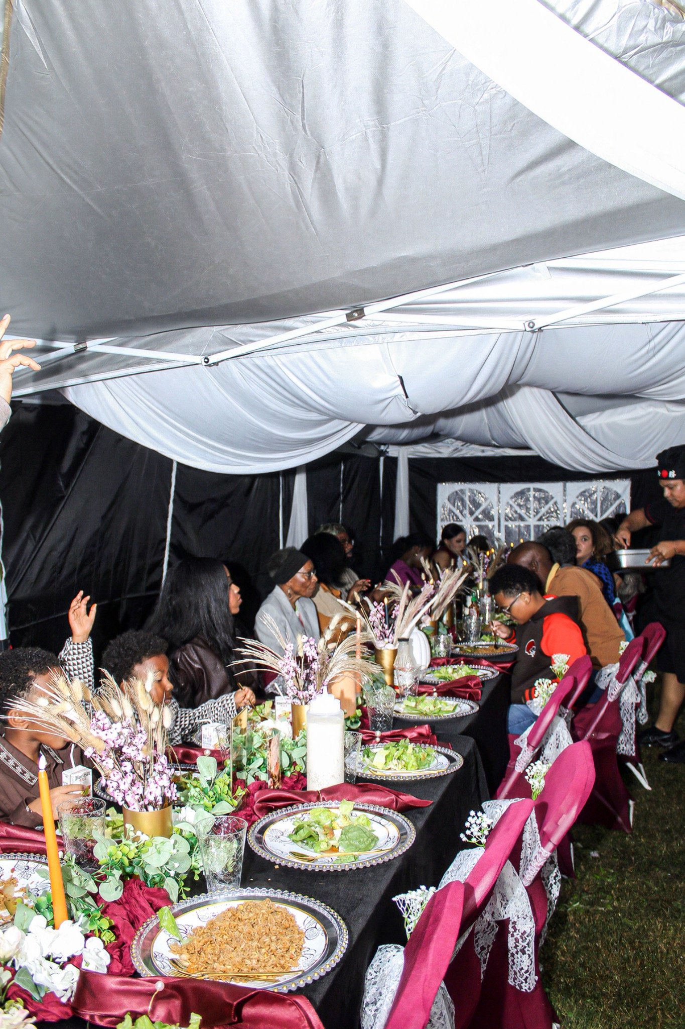 Guests gathered along the beautifully set dinner table