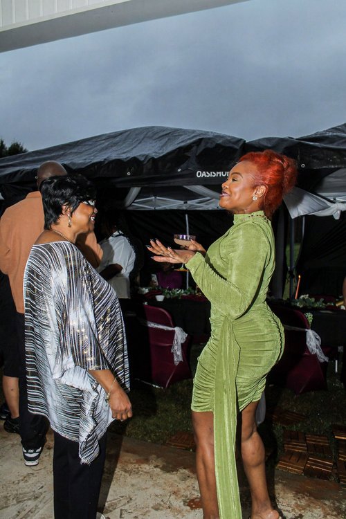 Sharing a conversation with a guest near the party tables