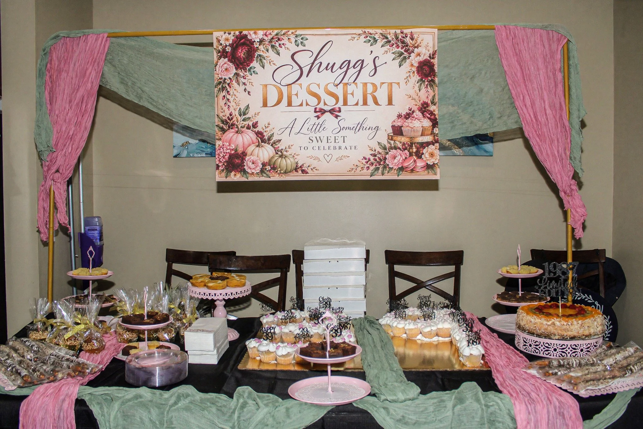 Birthday dessert table with blush and green draping