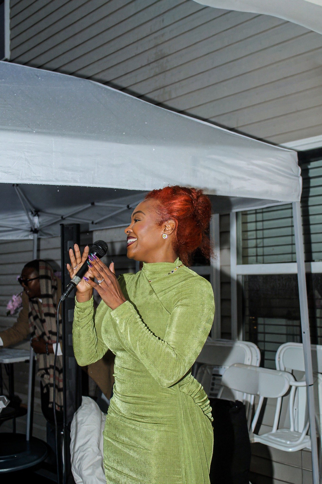 A candid moment speaking to birthday guests