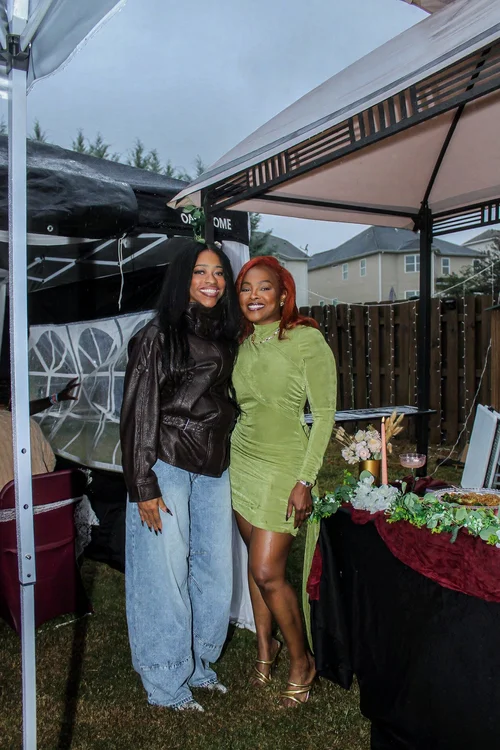 A full-length portrait with a friend at the celebration