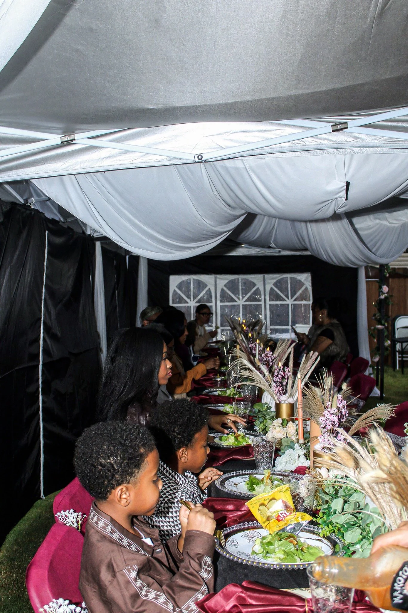 Guests gathered around the birthday dinner table