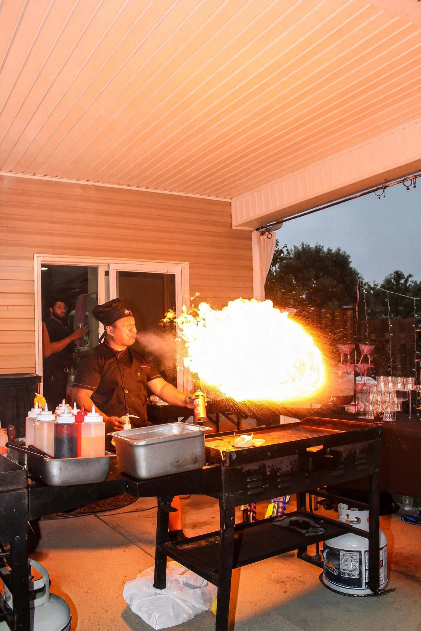 A bright burst of flame at the hibachi grill
