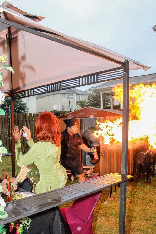 Guests enjoying the hibachi fire show