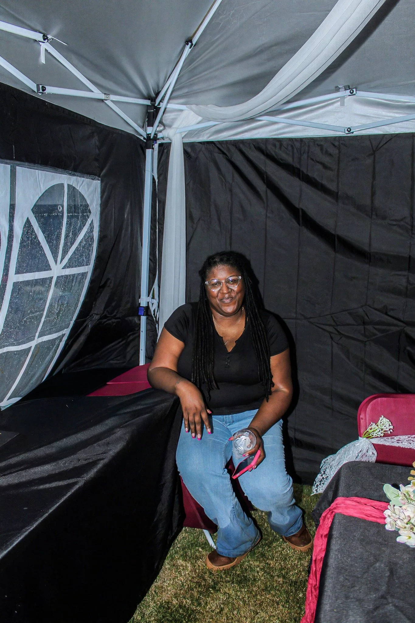 A guest smiling beneath the party tent