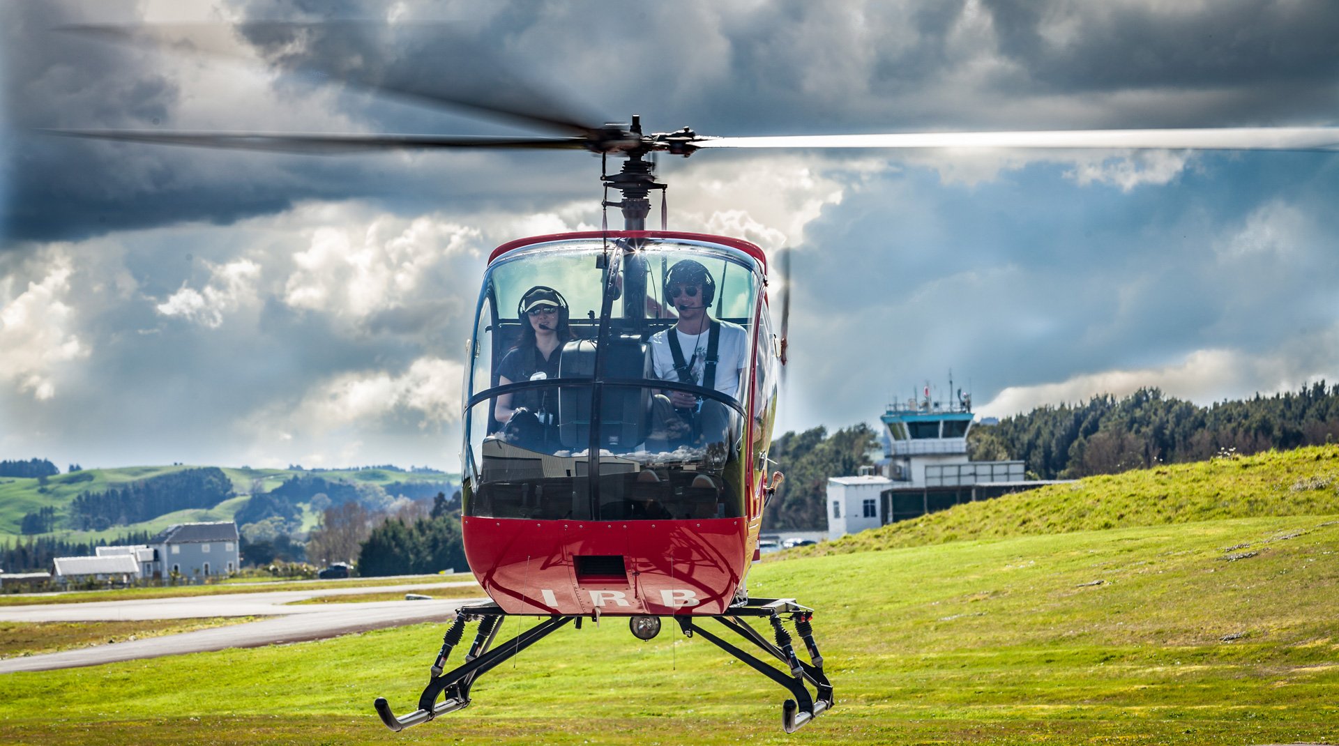 Two people flying a Cabri G2 helicopter during a training session