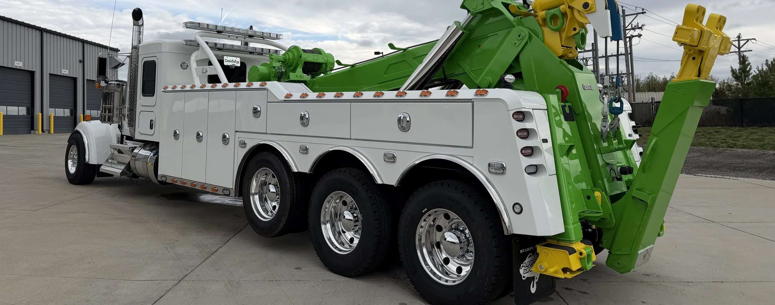 Tow truck fleet at a working towing yard