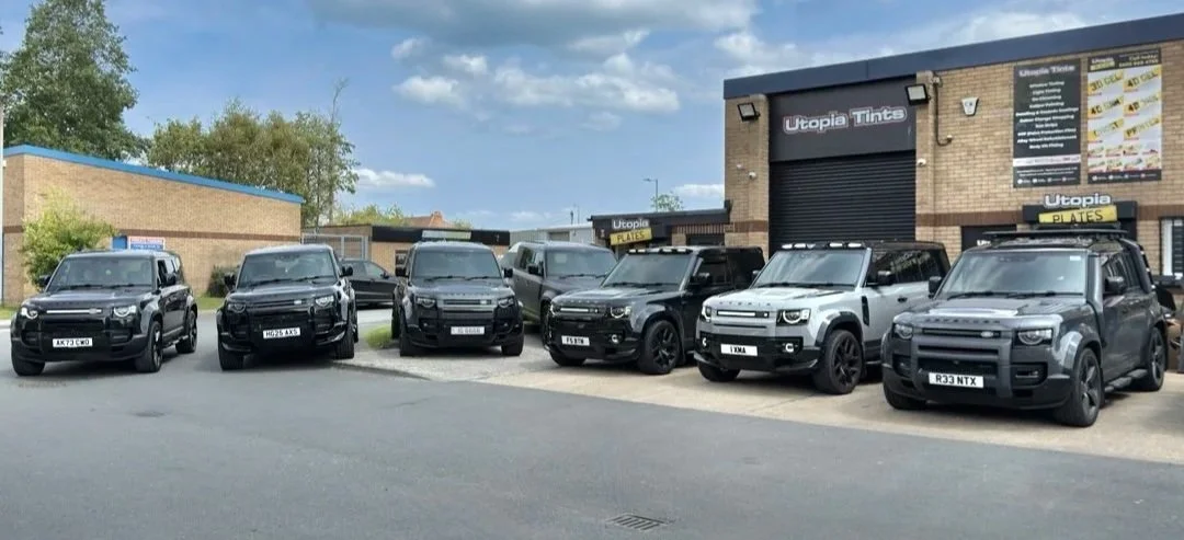 Seven Land Rover Defenders in the Utopia Tints workshop, Durham, 2025
