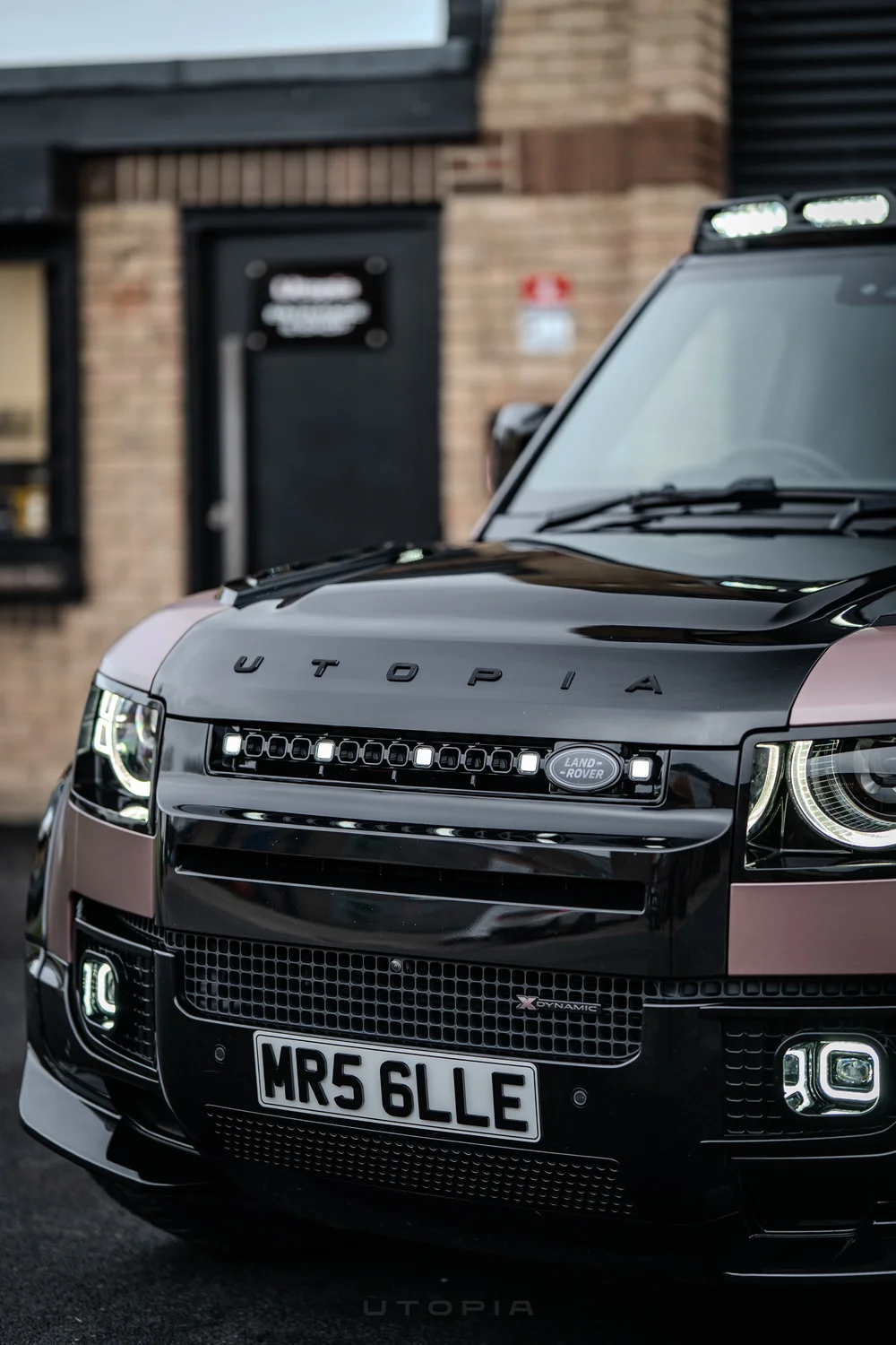OCTA style grille light DRL, a single line of square LED pods across a Defender grille