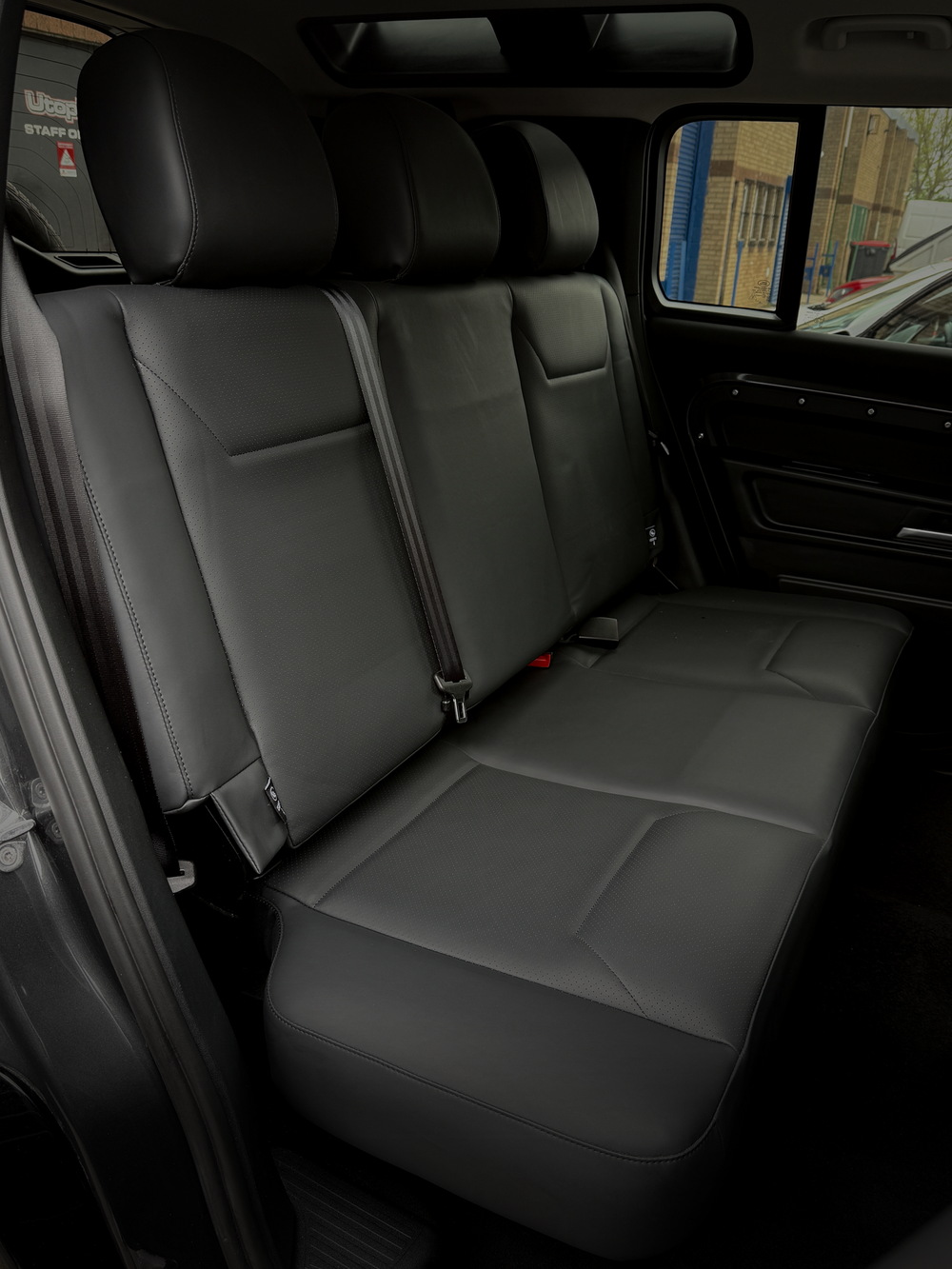 Land Rover Defender rear seat conversion fitted by Utopia Tints