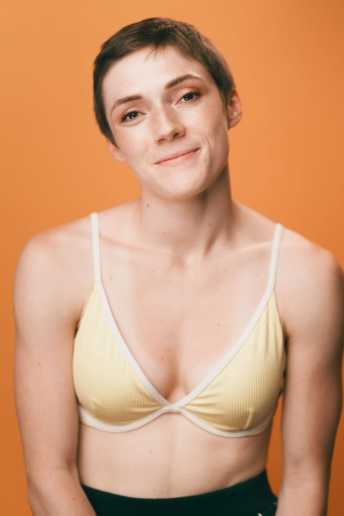 Hannah Schmidt portrait against an orange background