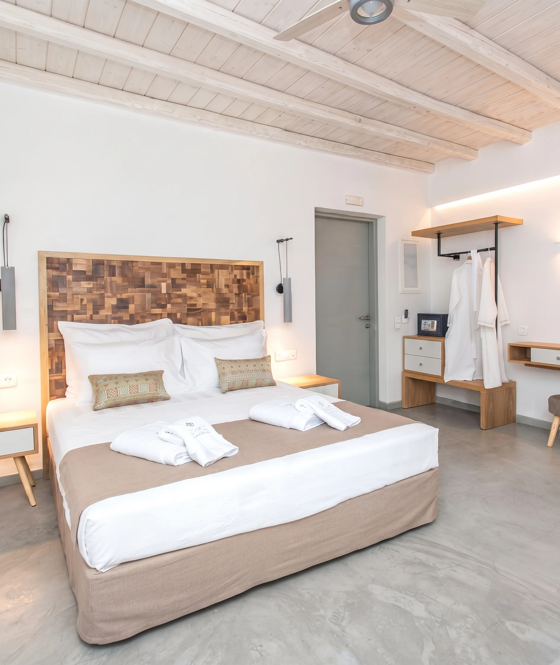 Modern hotel room, wooden headboard, workspace
