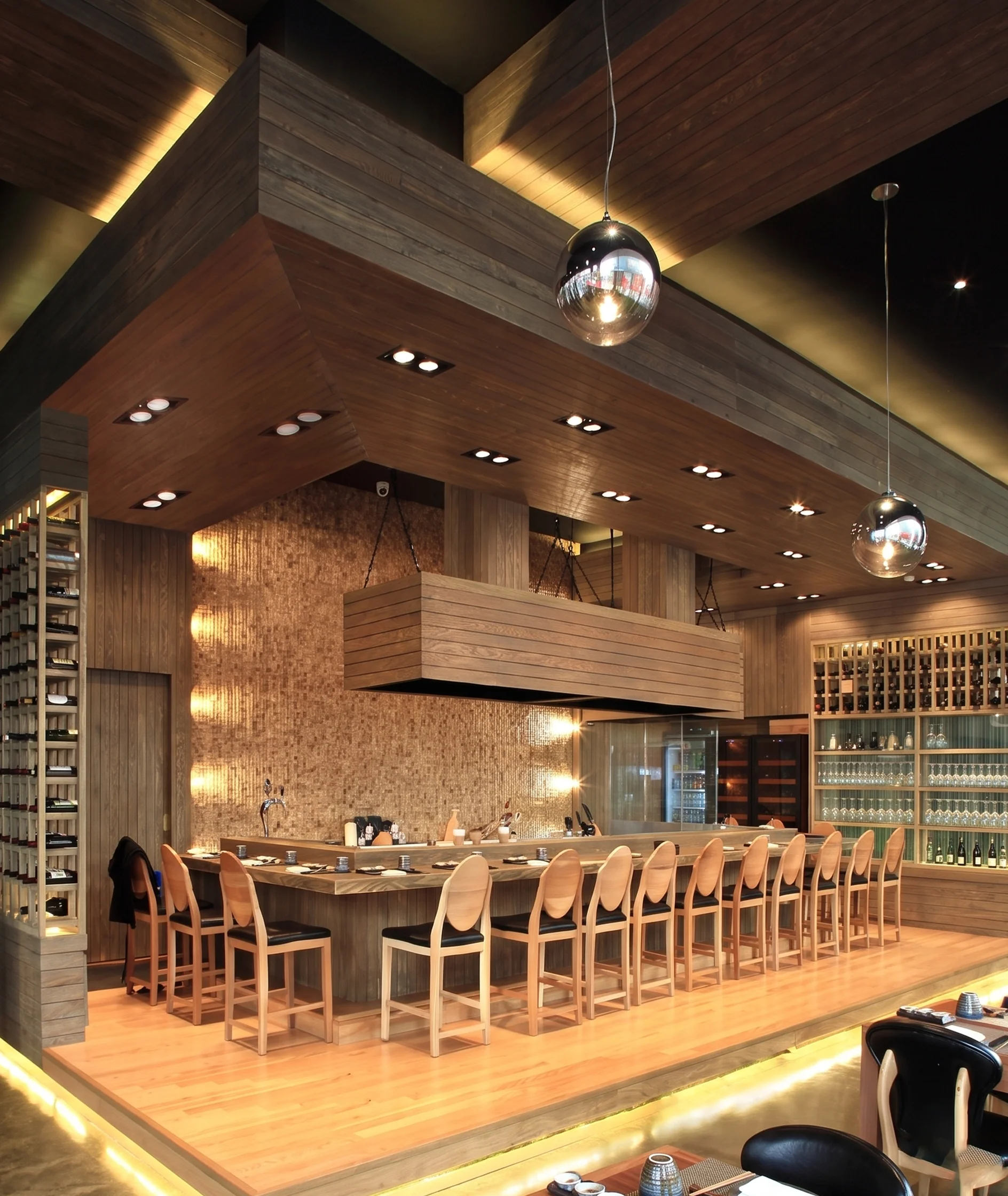 Restaurant bar counter with wood paneled walls