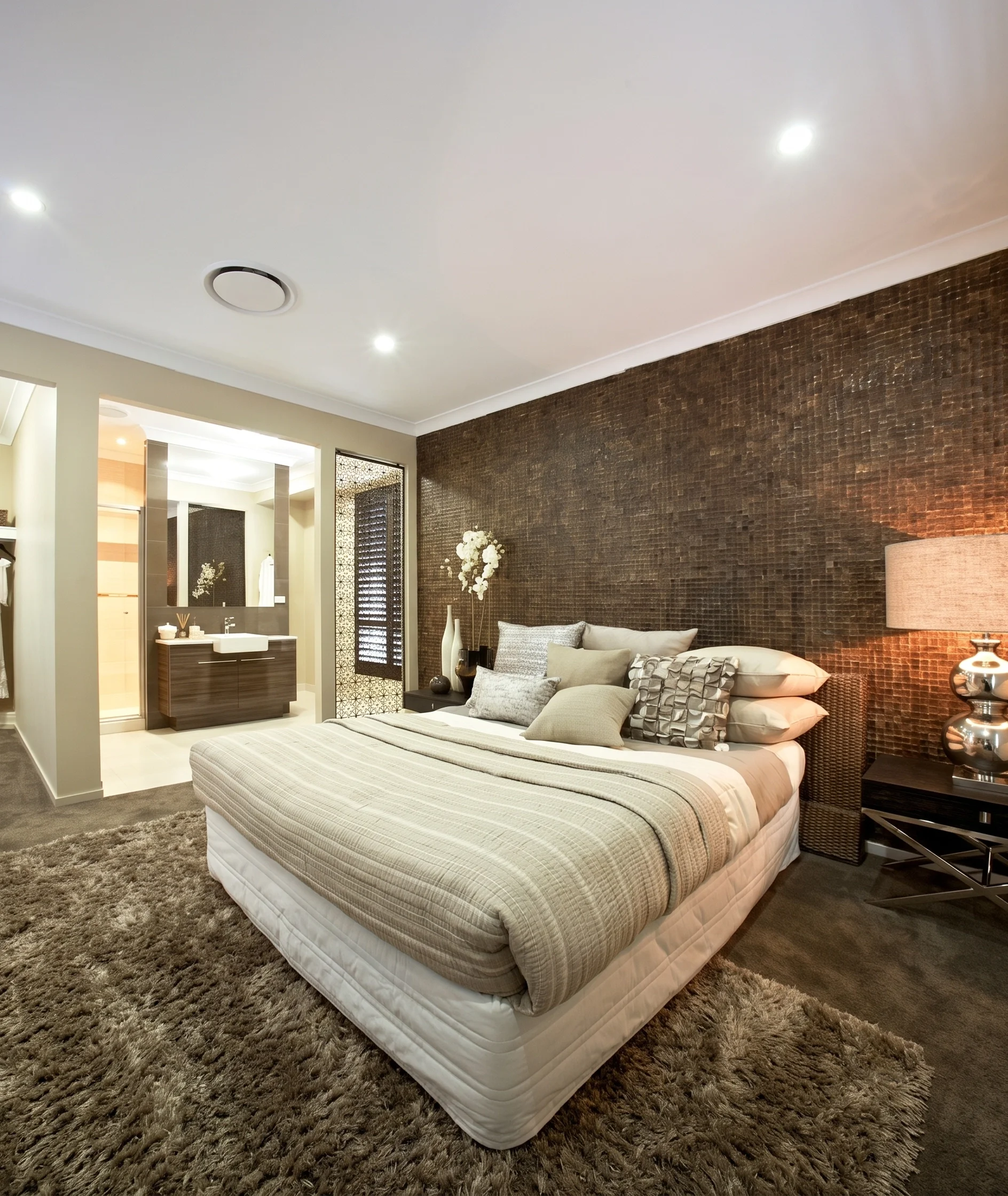 Modern bedroom with nightstand and open bathroom