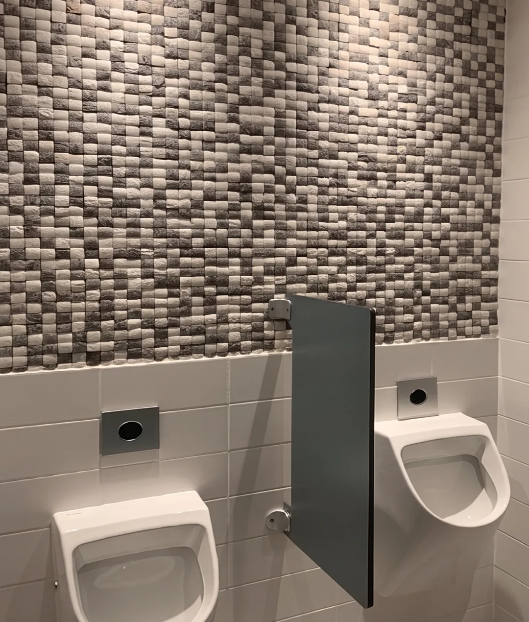 Modern restroom with textured stone tiles