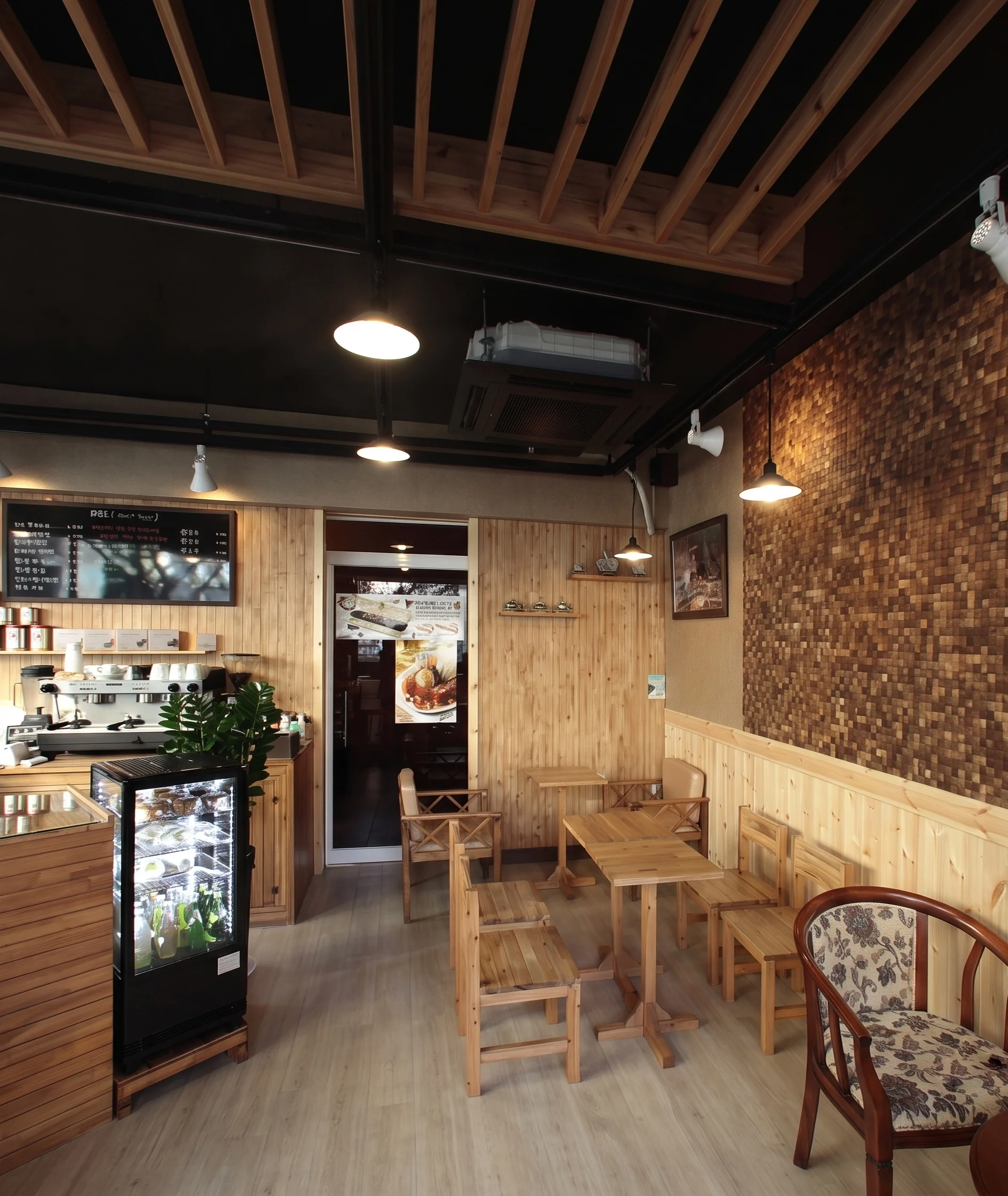 Cozy coffee shop with wooden furniture and wall decor