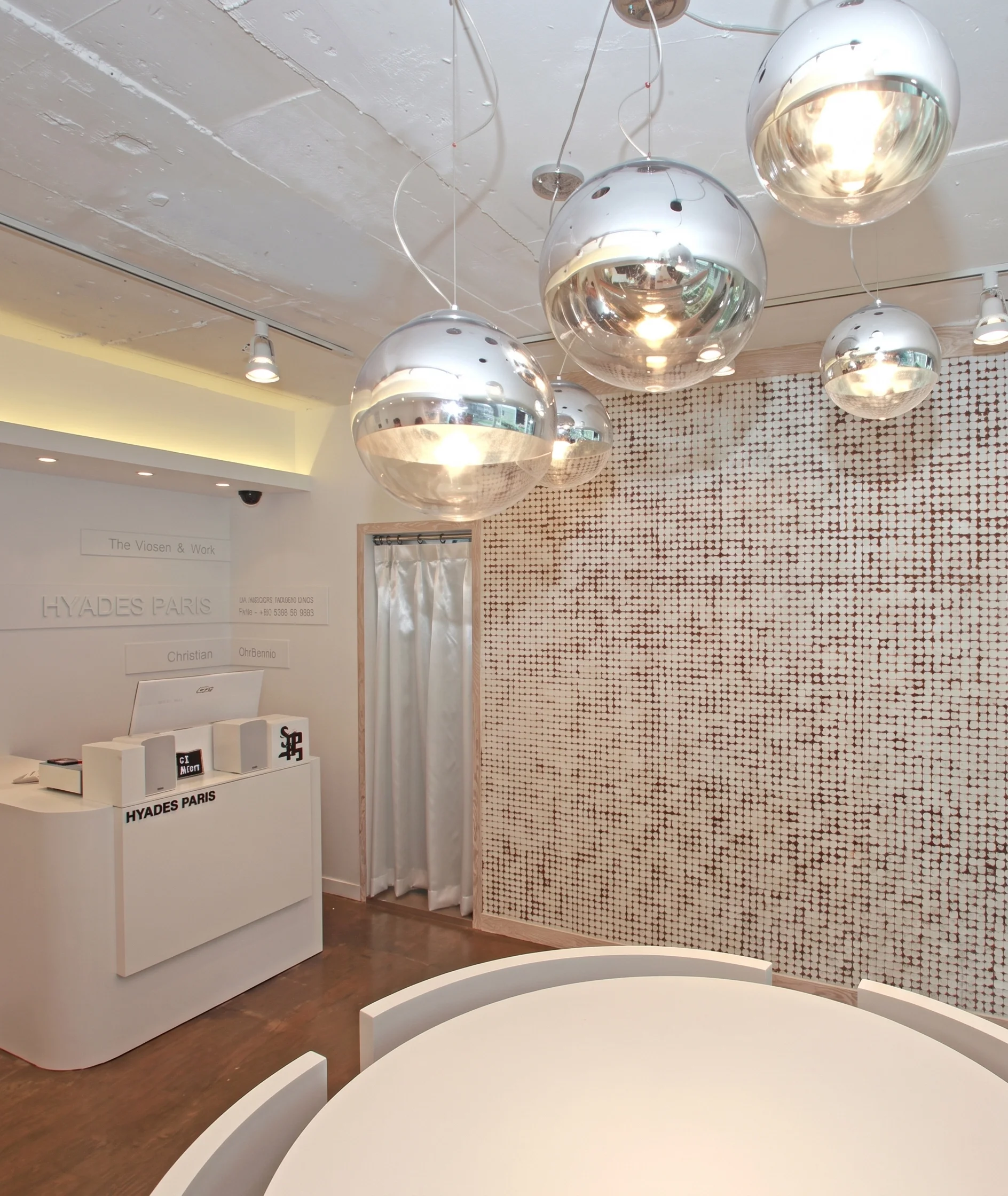 Showroom reception desk with mosaic tile wall