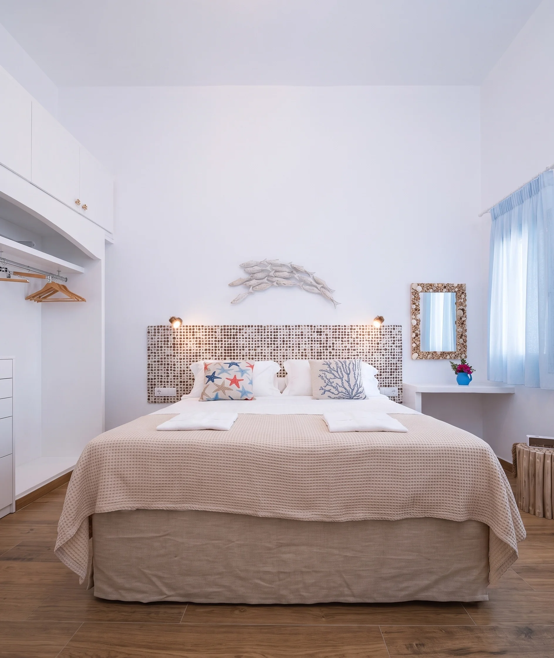 Coastal bedroom with mosaic tile headboard
