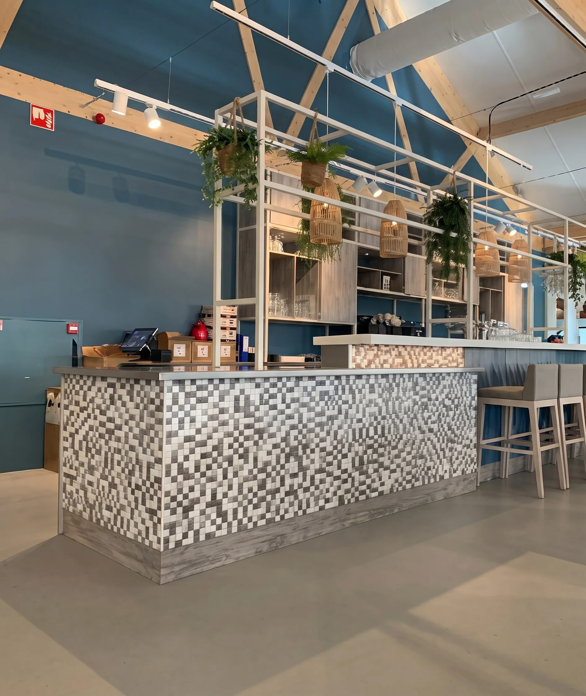 Cafe reception area with patterned front desk