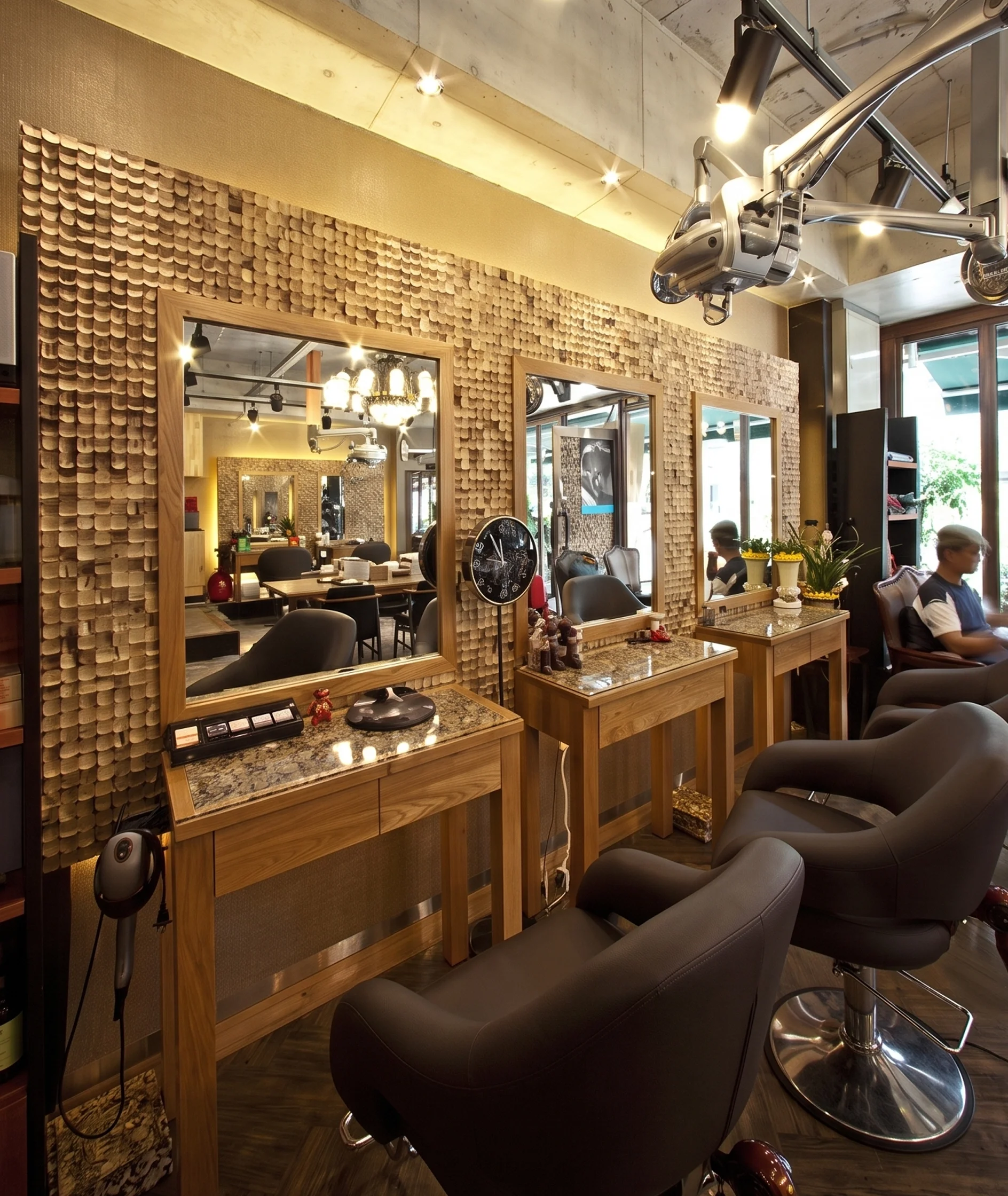 Modern salon with mirrors on a textured wooden wall