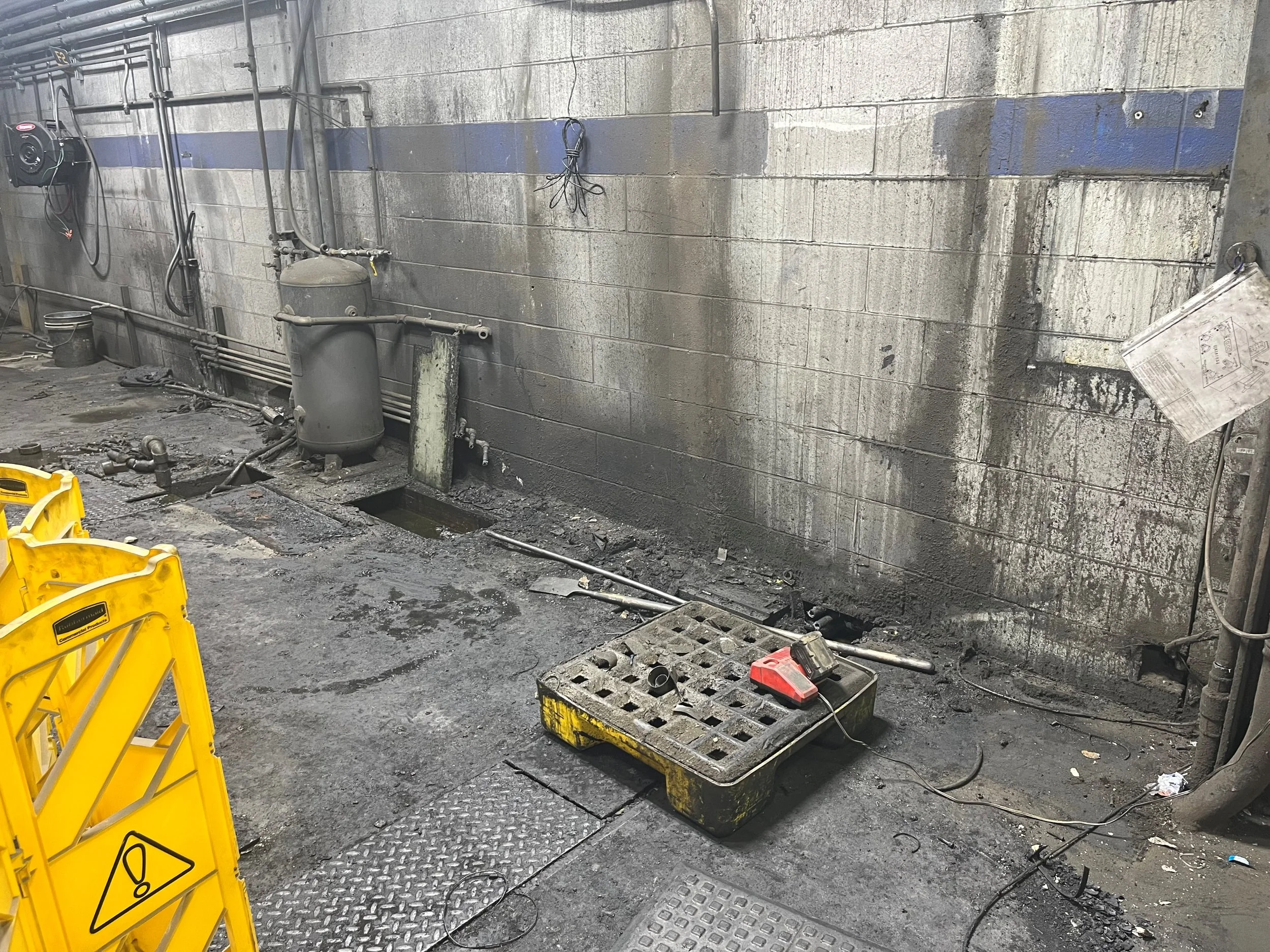 Crossroads technician performing lift-access industrial cleaning