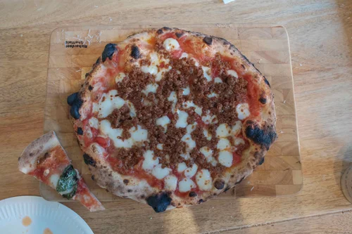 Our finished pizza with a blistered, leopard-spotted crust
