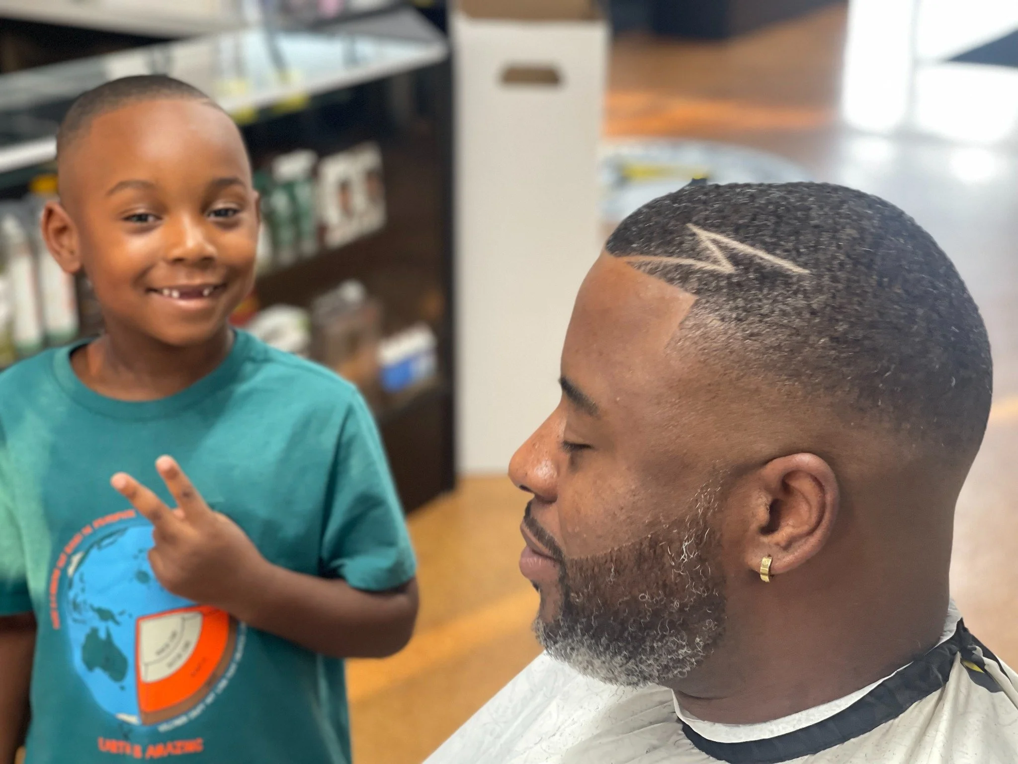 Wave haircut with custom design at Barber Skate Shop