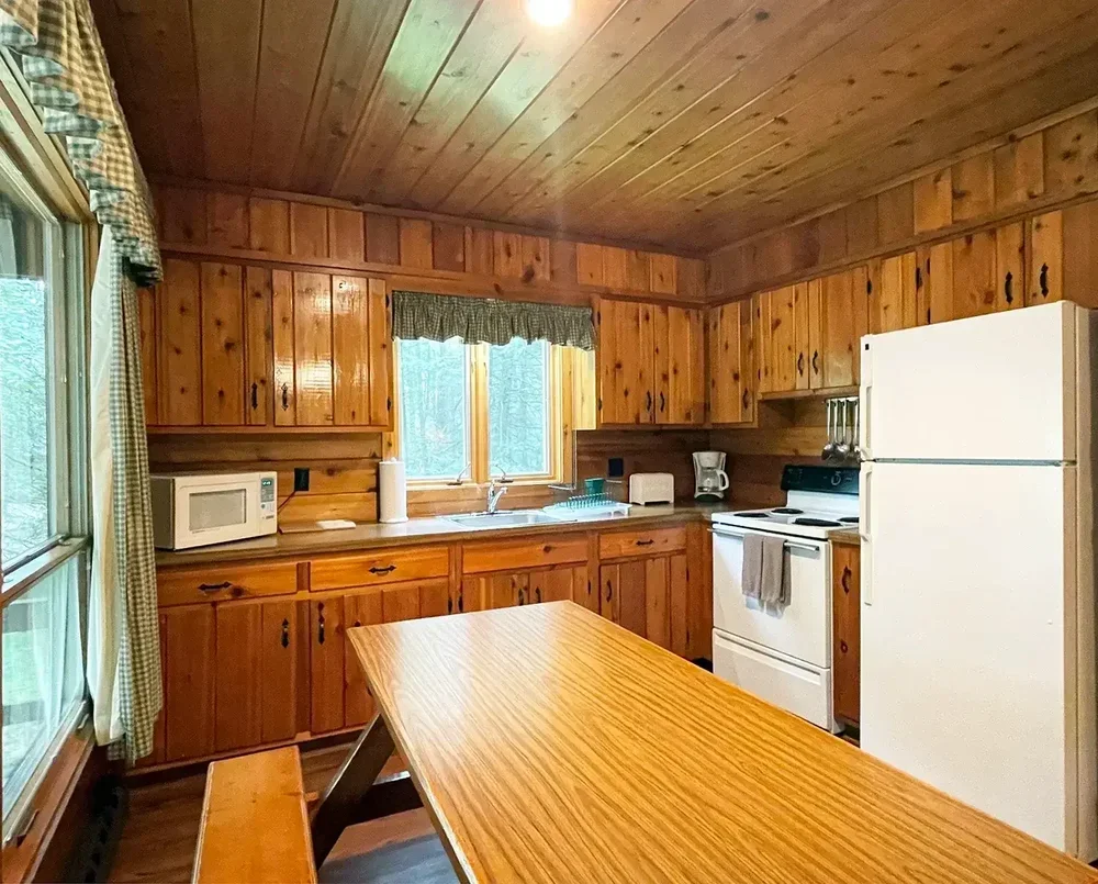 Cabin 40 full kitchen with pine cabinets and full-size appliances