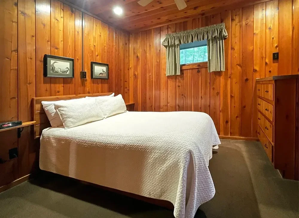 Cabin 36 bedroom with full bed and knotty pine walls